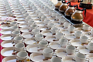 Group of empty ceramic cup and saucer serving tea or coffee in Hotel setting