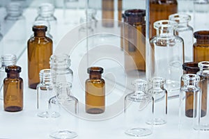 Group of empty medicine glass bottles, low-grip