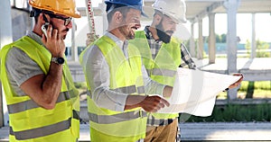 Group of engineering team had meeting at working site