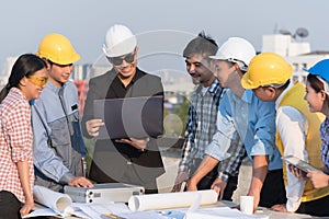 Group of engineers and architects at a construction site