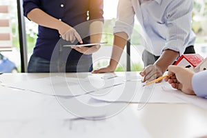 Group of engineers working together to plan the project at the meeting