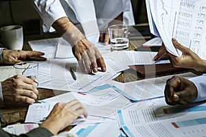 Group of entrepreneur analysing for investment in meeting room