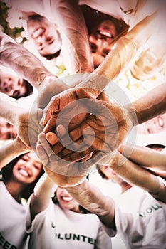 Group of environmentalists stacking hands