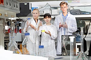 Group of European and Chinese scientists posing together at biochemical laboratory