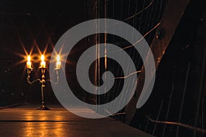 Group of evil candles burning in the darkness and copy space on