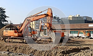 Group of excavators in the construction site during groundworks