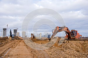 Group of the excavators for dig ground trenching at a construction site for foundation and installing storm pipes