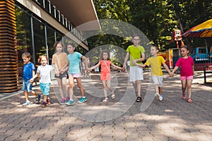 The group of excited preschoolers are running together