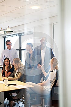 Group of executives gathered in conference room