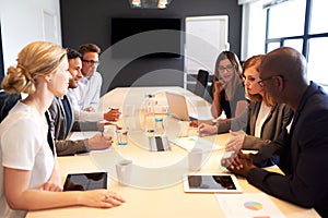 Group of executives having meeting in conference room