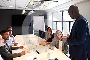 Group of executives sitting in conference room