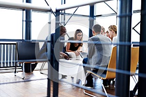 Group of executives sitting together and working