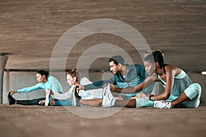 Group, exercise and people stretching as a fitness club for sports, health and wellness in an urban town together. Sport