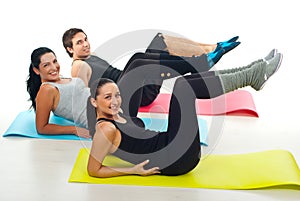 Group exercising on colorful mats