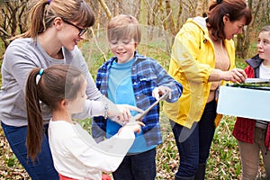 Group Exploring Woods At Outdoor Activity Centre photo