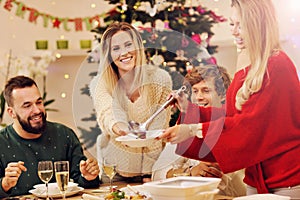 Group of family and friends celebrating Christmas dinner