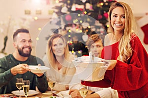 Group of family and friends celebrating Christmas dinner