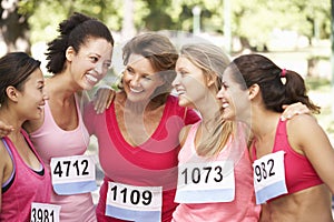 Group Of Female Athletes Competing In Charity Marathon Race