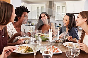 Group Of Female Friends Enjoying Dinner Party At Home