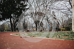 Group of female friends jogging together in a park for fitness