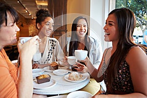 Group Of Female Friends Meeting In Cafe Restaurant