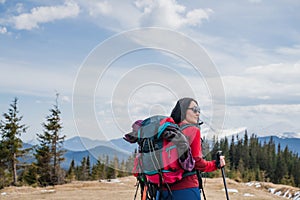 Group of female hikers in mountains during saffron blooming at spring