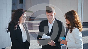 Group of female and male start-up business team celebrating success of project. Business people have fun throwing paper