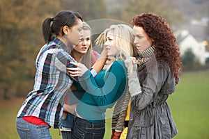 Group Of Female Teenagers Bullying Girl