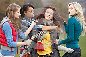 Group Of Female Teenagers Bullying Girl