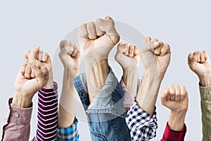 Group of fists raised in air photo