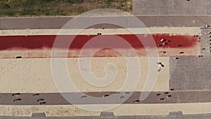 group fitness workout outdoors. fitness outdoors. aero, top view. Large group of people is practicing morning jog