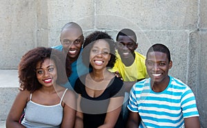 Group of five african american men and woman looking at camera