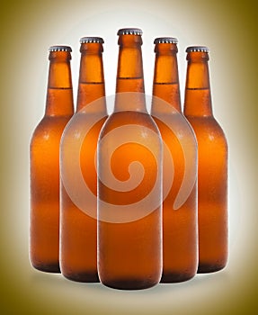 A group of five beer bottles in a diamond formation on color background.