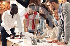 Group of five creative worker brainstorm together in office, new style of workspace, happy scene of people in office