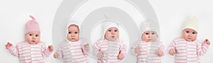 Group of five cute babies, 3 months old, in different hat