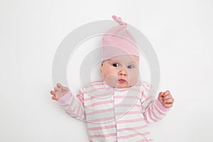 Group of five cute babies, 3 months old, in different hat