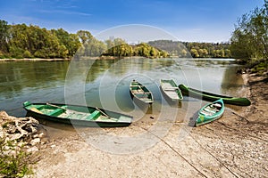 Five boats on the river bank