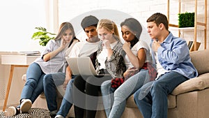 Group of Five Multiethnic Teenagers Engaged in a Collaborative Task