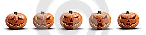 A group of five unlit spooky halloween pumpkins, Jack O Lantern with evil face and eyes