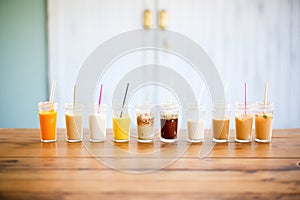 group of flavored syrups for coffee, neatly arranged