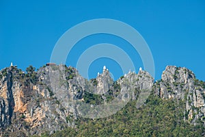 Group of floating pagodas on mountain peak with clear sky in temple of Wat Chaloem Phra Kiat, One of the most tourist attraction p