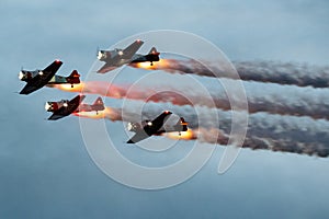 Group of flying aircraft against a cloudy sky during an airshow