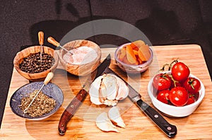 Group of food IngrÃ©dients and two chef`s knives