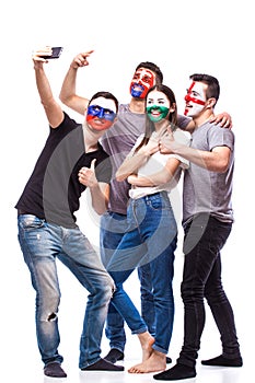 Group of football fans their national team: Slovakia, Wales, Russia, England take selfie photo