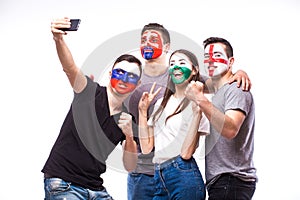 Group of football fans their national team: Slovakia, Wales, Russia, England take selfie