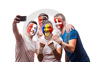 Group of football fans of their national team taking selfie photo