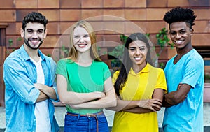 Group of four african american and latin and caucasian young adults