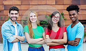 Group of four african and latin american and caucasian young adults