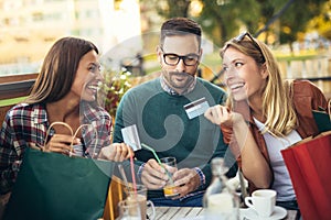 Group of four friends having fun a coffee together
