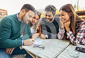 Group of four friends having fun a coffee together.